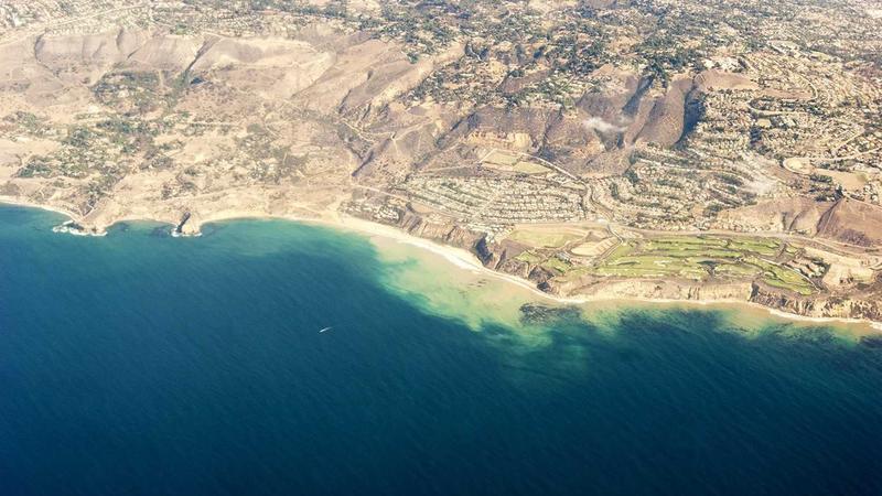Young entrepreneur juggling tasks in startup office
